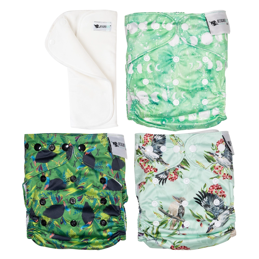 Four colorful patterned cloth diapers on a white background
