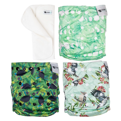 Four colorful patterned cloth diapers on a white background